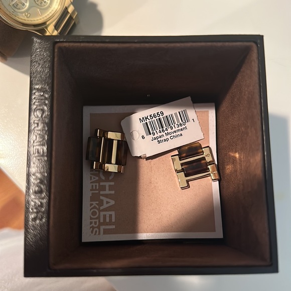 Michael Kor’s tortoise shell gold Watch